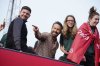 FILE - Wrexham co-owner Ryan Reynolds, center, celebrates with members of the Wrexham FC soccer team the promotion to the Football League in Wrexham, Wales, on May 2, 2023. (AP Photo/Jon Super, File)