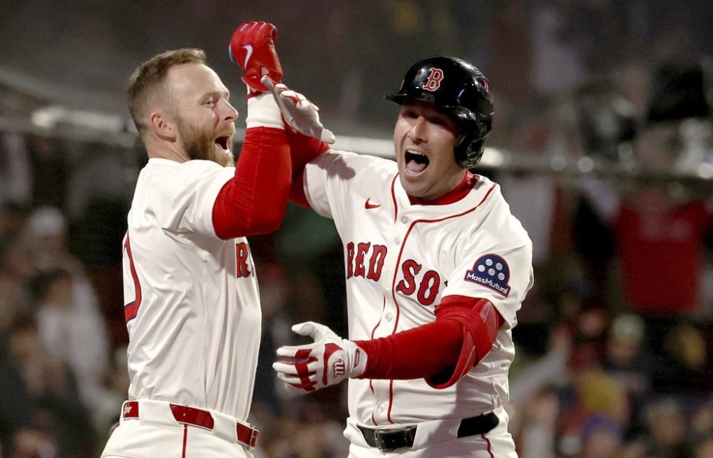 Boston Red Sox's Trevor Story, left, and Alex Bregman, right, celebrate Bregman's three-run homer in the third inning during the second baseball game of a doubleheader against the St. Louis Cardinals, Sunday, April 6, 2025, in Boston. (AP Photo/Mark Stockwell)
