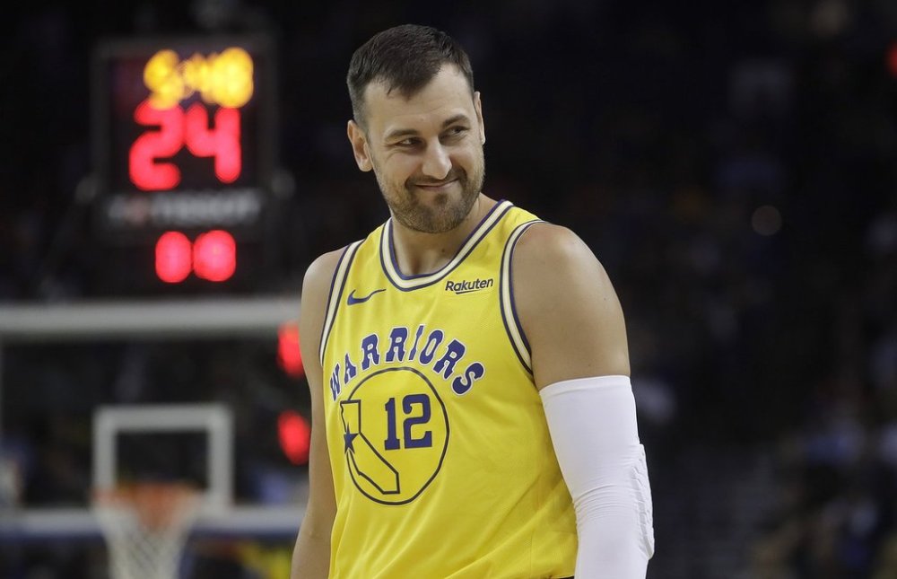 FILE - In this Tuesday, April 2, 2019 file photo, Golden State Warriors center Andrew Bogut looks on during an NBA basketball game against the Denver Nuggets in Oakland, Calif.. (AP Photo/Jeff Chiu, file)