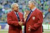 FILE - Seattle Sounders head coach Sigi Schmid, right, is honored with a red jacket presented by Hank Steinbrecher, left, of the U.S. Soccer Hall of Fame, during a pre-match ceremony, Sunday, Oct. 4, 2015, before an MLS soccer match between the Sounders and the Los Angeles Galaxy, in Seattle. (AP Photo/Ted S. Warren, FIle)