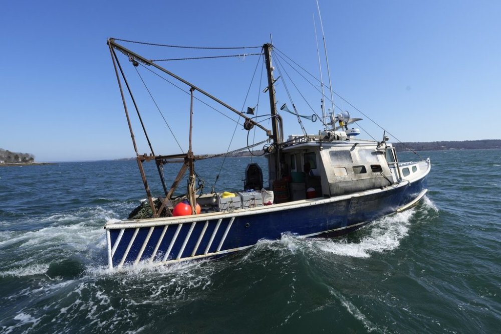 A scallop fishing boat leaves the dock, Tuesday, March 11, 2025, in Yarmouth, Maine. (AP Photo/Robert F. Bukaty)