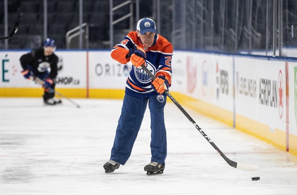 Prime Minister Mark Carney skates with the Edmonton Oilers during a visit to Edmonton on Thursday, March 20, 2025. THE CANADIAN PRESS/Jason Franson