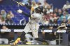 Pittsburgh Pirates' Oneil Cruz hits a two-run home run during the fifth inning of a baseball game against the Miami Marlins, Friday, March 28, 2025, in Miami. (AP Photo/Lynne Sladky)