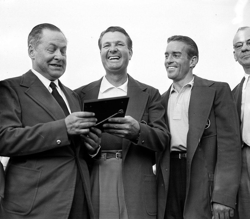 FILE - Bob Jones, president of Augusta National Golf Club, left, presents a plaque to Jimmy Demaret, center, as amateur Frank Stranahan, at right, looks on April 9, 1950 at the Augusta, Ga. (AP Photo, file)