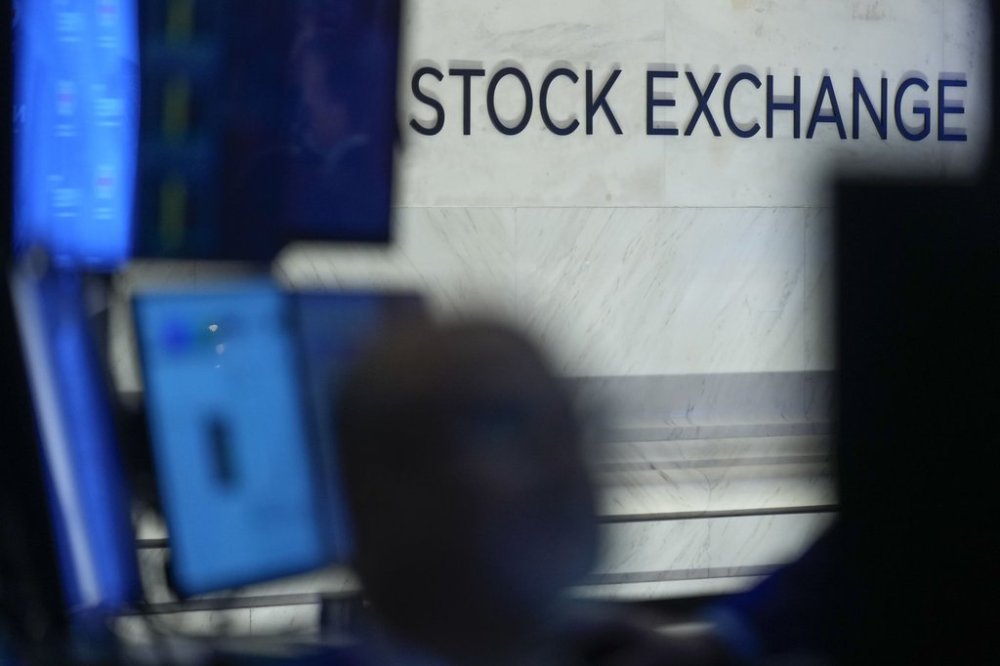 FILE - Traders work on the floor at the New York Stock Exchange in New York, Thursday, Jan. 2, 2025. (AP Photo/Seth Wenig)