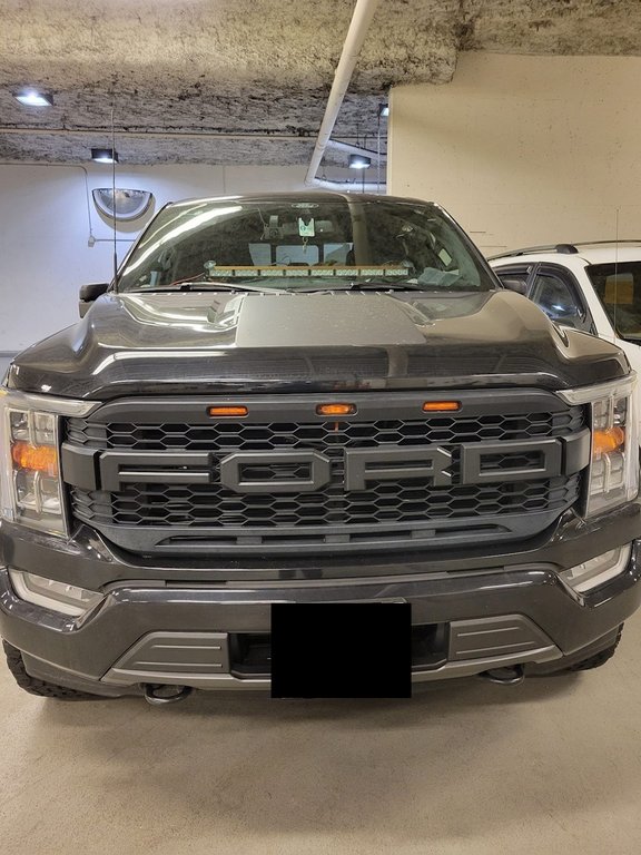 A grey Ford F150 pickup truck, with a light bar in the centre console behind the windshield, is shown in an undated handout photo. North Vancouver, B.C., RCMP released the photo of the truck, which they say was seized when the driver was arrested earlier this month for impersonating an officer. They are asking if anyone else was pulled over by the truck. THE CANADIAN PRESS/HO-RCMP, *MANDATORY CREDIT*