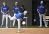 Toronto Blue Jays pitcher Chris Bassitt, front, throws a pitching session during spring training in Dunedin Fla., on Sunday, February 16, 2025. THE CANADIAN PRESS/Nathan Denette