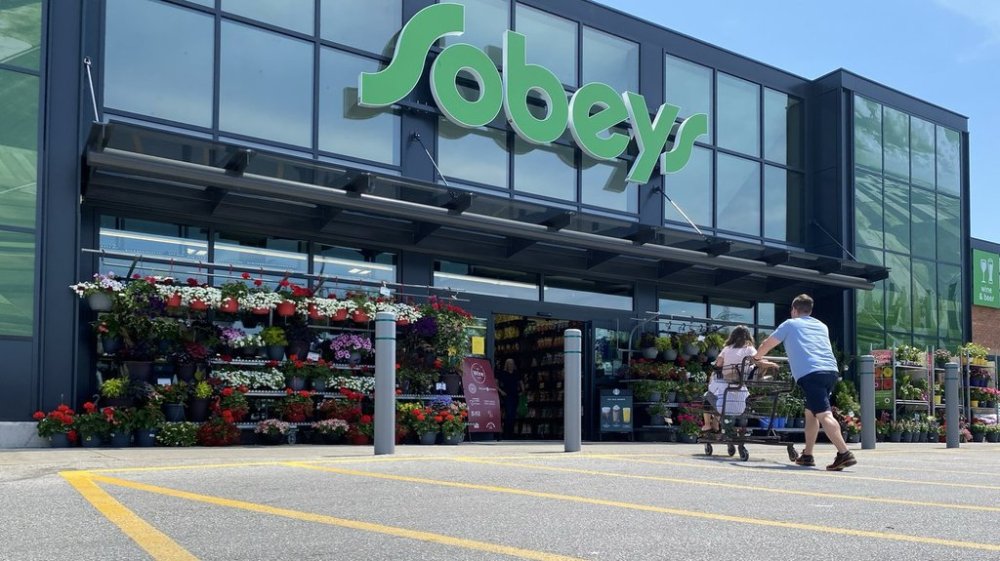 Shoppers enter a west-end Toronto Sobeys grocery store, Sunday, June 26, 2023. Empire Co. Ltd. says it earned a third-quarter profit of $146.1 million as its sales rose during the period. THE CANADIAN PRESS/Graeme Roy
