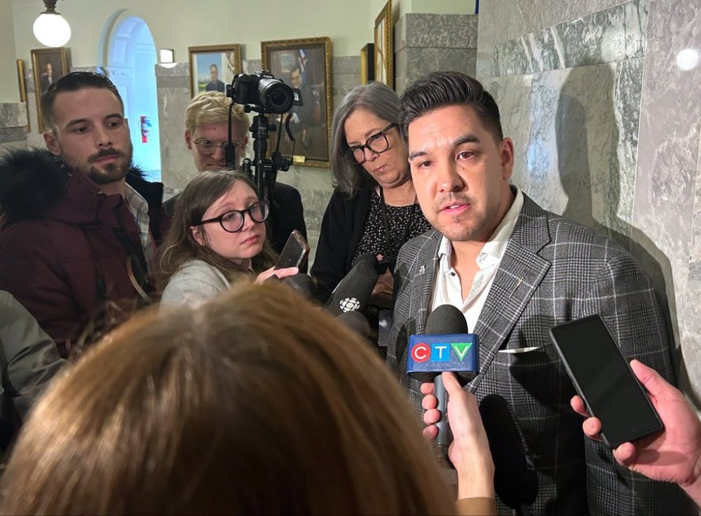 Lesser Slave Lake MLA Scott Sinclair, right, speaks with members of the media at the Alberta legislature building in Edmonton on Monday March 10, 2025. THE CANADIAN PRESS/Jack Farrell