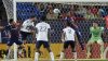 Vancouver Whitecaps defender Tristan Blackmon, second from left, scores a goal against FC Dallas defenders Shaq Moore (18), Marco Farfan (4) and goalkeeper Maarten Paes (1) during second-half MLS soccer match action in Frisco, Texas, Saturday, March 15, 2025. (AP Photo/LM Otero)