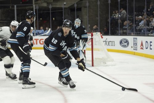 Utah Hockey Club center Jack McBain (22) moves the puck on the ice against Los Angeles Kings during the second period of an NHL hockey game, Thursday, April 3, 2025, in Salt Lake City. (AP Photo/Melissa Majchrzak)