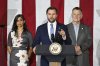 Vice President JD Vance, center, speaks at a rally about 