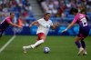 FILE - United States' Trinity Rodman (5) dribbles passt Germany's Felicitas Rauch, right, during a women's semifinal soccer match between the United States and Germany at the 2024 Summer Olympics at Lyon Stadium in Decines, France, Aug. 6, 2024. (AP Photo/Silvia Izquierdo, File)