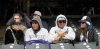 Grace Brown, from left, Juan Miranda, Aaron Miranda and Josefa Miranda, sit in the stands at Coors Field as the snow begins to ball before the Colorado Rockies home-opening baseball game the Athletics, Friday, April 4, 2025, in Denver. (Christian Murdock/The Gazette via AP)