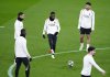 PSG's Achraf Hakimi, Ousmane Dembele and Goncalo Ramos attend a training session at the Anfield stadium in Liverpool, England, Monday, March 10, 2025, a day ahead of their Champions League round of 16 match against Liverpool. (Peter Byrne/PA via AP)