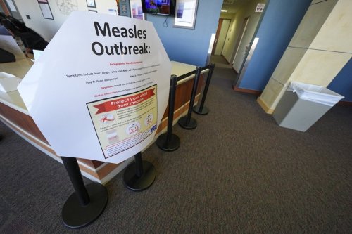 FILE - A measles sign is seen at the Texas Tech University Health Sciences Center, Feb. 25, 2025, in Lubbock, Texas. (AP Photo/Julio Cortez, file)