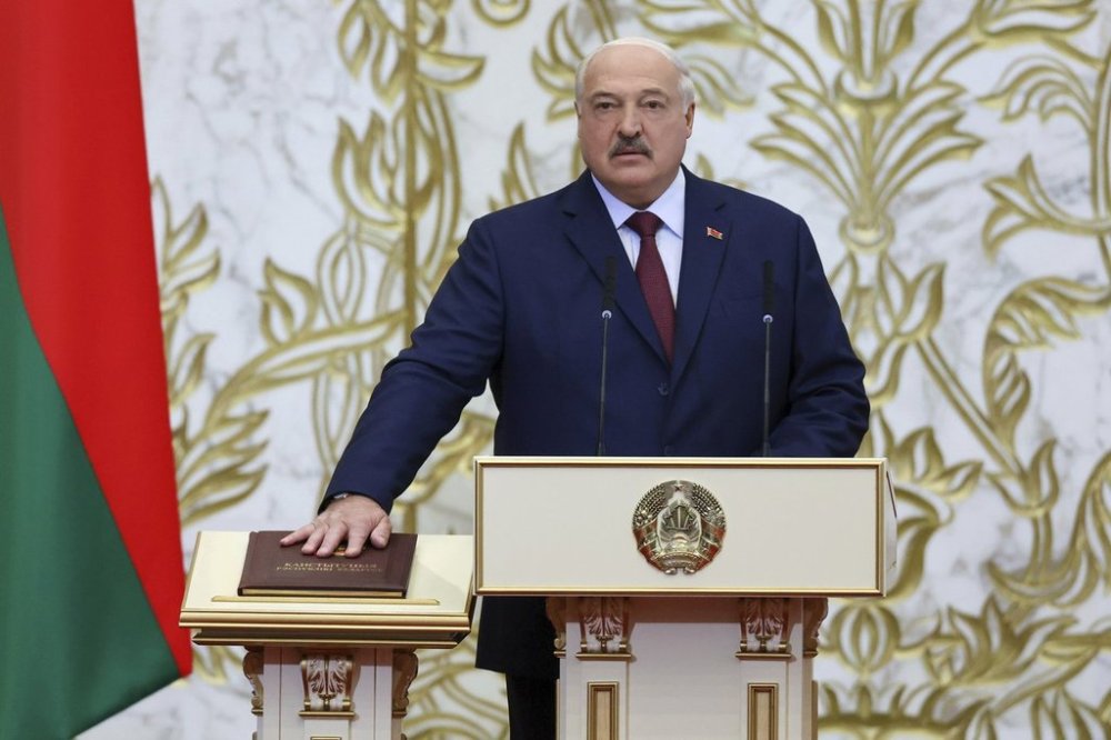 In this photo released by Belarus' Presidential Press Service, Belarusian President Alexander Lukashenko takes his oath of office during his inauguration ceremony at the Palace of the Independence in Minsk, Belarus, Tuesday, March 25, 2025. (Belarus' Presidential Press Service via AP)