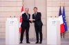 Prime Minister Mark Carney, left, and President of France Emmanuel Macron shake hands after delivering a joint statement at the Palais de l'Elysee in Paris, France on Monday, March 17, 2025. THE CANADIAN PRESS/Sean Kilpatrick
