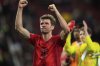 Bayern's Thomas Mueller celebrate after the German Bundesliga soccer match between Augsburg and Bayern Munich in Augsburg, Friday, April 4, 2025. (AP Photo/Matthias Schrader)