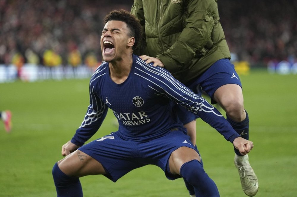 PSG's Desire Doue celebrates after the Champions League round of 16 second leg soccer match between Liverpool and Paris Saint-Germain at Anfield in Liverpool, England, Tuesday, March 11, 2025. (AP Photo/Jon Super)