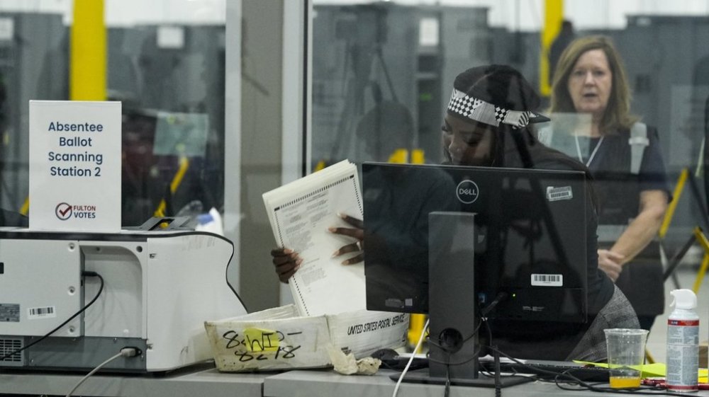 FILE - An election staffer works at the Fulton County Election Hub and Operation Center, Tuesday, Nov. 5, 2024, in Atlanta. (AP Photo/John Bazemore, File)