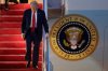 President Donald Trump walks down the stairs of Air Force 1 upon his arrival at Joint Base Andrews, Md., Sunday, March 30, 2025. THE CANADIAN PRESS/AP-Luis M. Alvarez