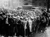 FILE - Thousands of unemployed people gather outside City Hall in Cleveland during the Great Depression, after some 2,000 jobs were made available for park improvements and repairs, Oct. 9, 1930. (AP Photo, File)