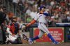 New York Mets' Juan Soto (22) hits a home run as Houston Astros catcher Yainer Diaz reaches for the pitch during the third inning of a baseball game Friday, March 28, 2025, in Houston. (AP Photo/David J. Phillip)