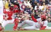 St. Louis Cardinals' Jordan Walker (18) scores at the plate despite an attempted tag by Boston Red Sox catcher Connor Wong in the fourth inning during the first baseball game of a doubleheader, Sunday, April 6, 2025, in Boston. (AP Photo/Mark Stockwell)