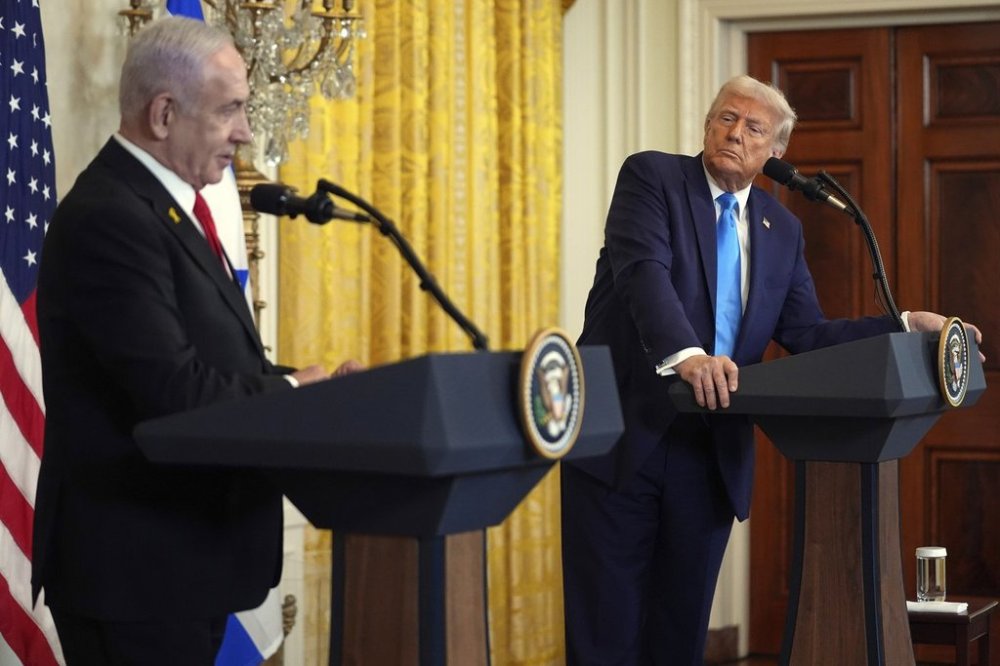 FILE - President Donald Trump listens as Israel's Prime Minister Benjamin Netanyahu speaks during a news conference in the East Room of the White House, Feb. 4, 2025, in Washington. (AP Photo/Evan Vucci, File)