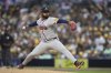 Atlanta Braves starting pitcher Reynaldo Lopez works against a San Diego Padres batter during the first inning of a baseball game Friday, March 28, 2025, in San Diego. (AP Photo/Gregory Bull)