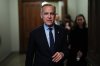 Liberal Leader Mark Carney leaves a caucus meeting in Ottawa, Monday, March 10, 2025. THE CANADIAN PRESS/Sean Kilpatrick