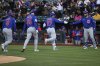 Chicago Cubs designated hitter Seiya Suzuki celebrates back to the dugout followed by Chicago Cubs right fielder Kyle Tucker and Chicago Cubs left fielder Ian Happ after hitting a three run home run in the first inning of a baseball game Tuesday, April 1, 2025, in West Sacramento, Calif. (AP Photo/Scott Marshall)