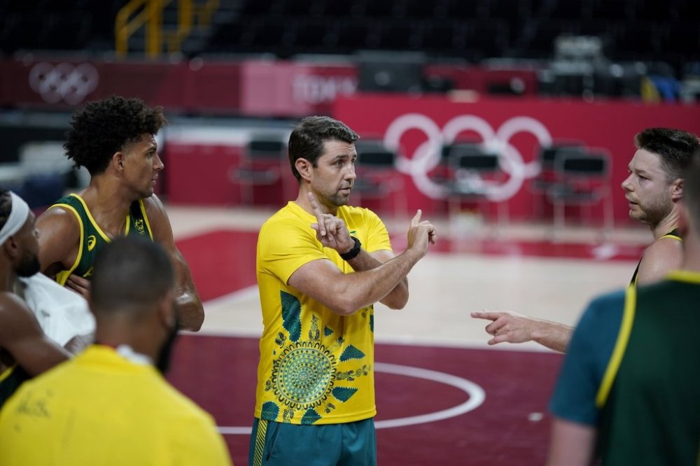 FILE - Australia assistant coach Adam Caporn talks to players during a men's basketball practice at the Tokyo 2020 Olympics, in Saitama, Japan, Thursday, July 22, 2021. (AP Photo/David Goldman,File)