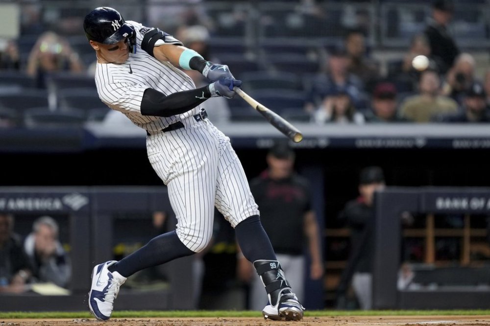 New York Yankees' Aaron Judge homers on a fly ball to right center field, his 500th extra base hit, during the first inning of a baseball game against the Arizona Diamondbacks, Thursday, April 3, 2025, in New York. (AP Photo/Julia Demaree Nikhinson)