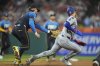 Philadelphia Phillies first baseman Bryce Harper, left, tags out Los Angeles Dodgers' Andy Pages in a rundown during the sixth inning of a baseball game, Friday, April 4, 2025, in Philadelphia. (AP Photo/Matt Rourke)