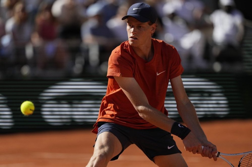 FILE - Italy's Jannik Sinner plays a shot against Spain's Carlos Alcaraz during their semifinal match of the French Open tennis tournament at the Roland Garros stadium in Paris, Friday, June 7, 2024. (AP Photo/Thibault Camus, File)