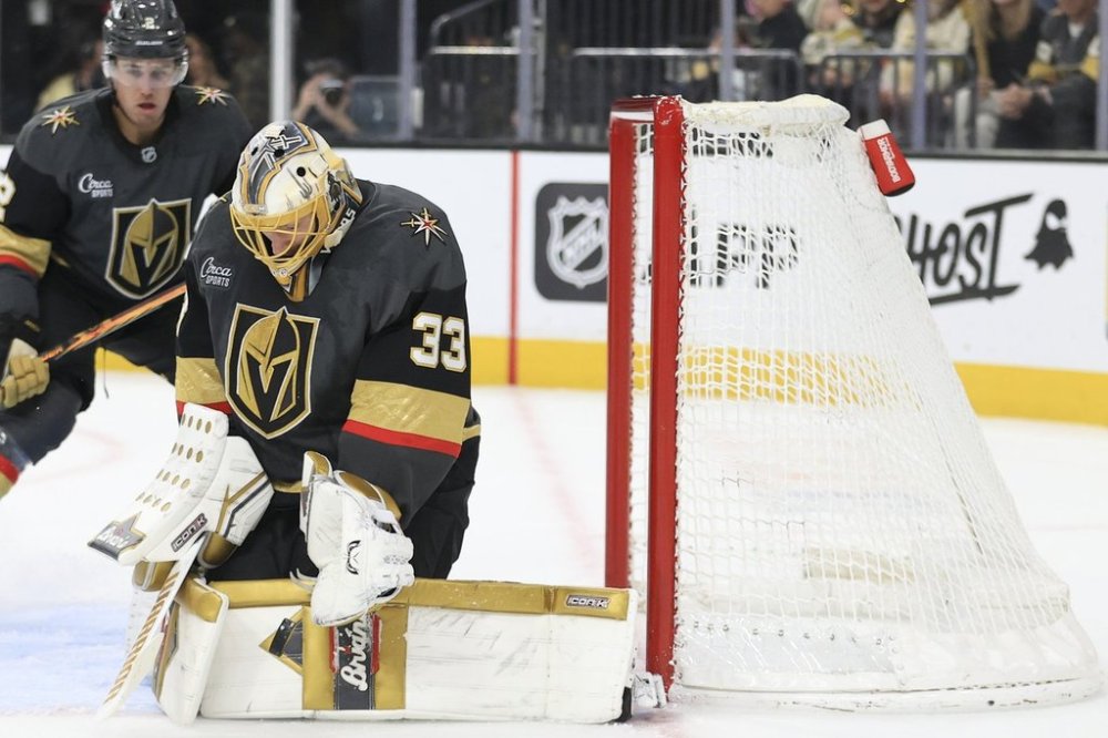 Vegas Golden Knights goaltender Adin Hill (33) makes a save during the first period of an NHL hockey game against the New Jersey Devils, Sunday, March 2, 2025, in Las Vegas. (AP Photo/Ian Maule)
