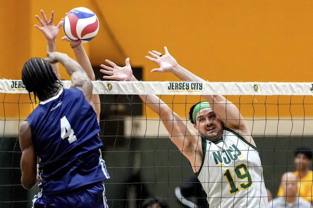 Damon LaSalle (19) blocks against University of Mount Saint Vincent's Olatomiwa Ibitayo (4) during a men's NCAA Division III college volleyball game, Wednesday, March 5, 2025, at New Jersey City University in Jersey City, N.J. (AP Photo/Julia Demaree Nikhinson)