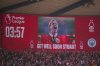 A tribute to former Nottingham Forest and Manchester City player Stuart Pearce is displayed in the third minute on the big screen follow his health scare during the English Premier League soccer match at the City Ground, Nottingham, Saturday March 8, 2025. (Mike Egerton/PA via AP)