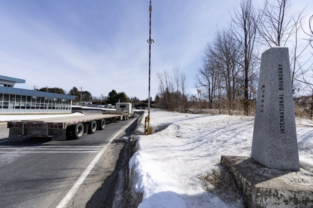 A truck passes the border marker entering Canada from Vermont at the Highway 55 Port of Entry in Stanstead, Que., Thursday, March 13, 2025. THE CANADIAN PRESS/Christinne Muschi