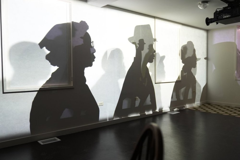 A video projection by Manual Cinema uses animation, shadow puppets and oral installation to help museum visitors