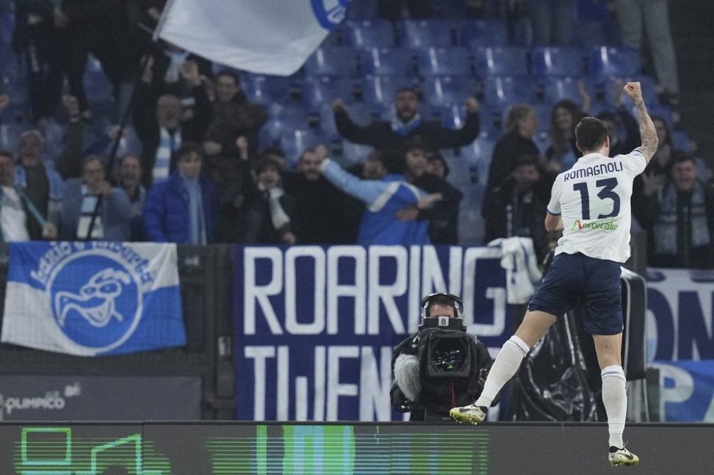 Lazio's Alessio Romagnoli celebrates after scoring his side's first goal during the Serie A soccer match between Lazio and Udinese at the Rome's Olympic stadium, Italy, Monday, March 10, 2025. (Alfredo Falcone/LaPresse via AP)