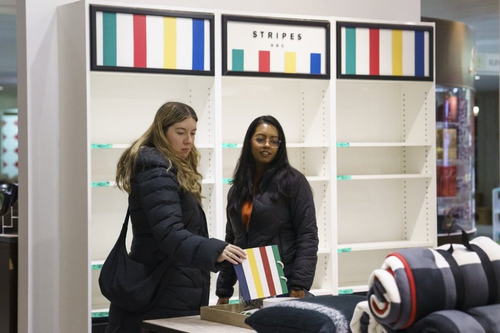 Shoppers browse at a Hudson's Bay store in Toronto on Monday, March 17, 2025. THE CANADIAN PRESS/Christopher Katsarov