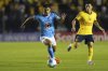 Erik Lira of Mexico's Cruz Azul, center, dribbles the ball past Alejandro Zendejas of Mexico's America during a CONCACAF Champions Cup first leg quarterfinal soccer match in Mexico City, Tuesday, April 1, 2025. (AP Photo/Eduardo Verdugo)