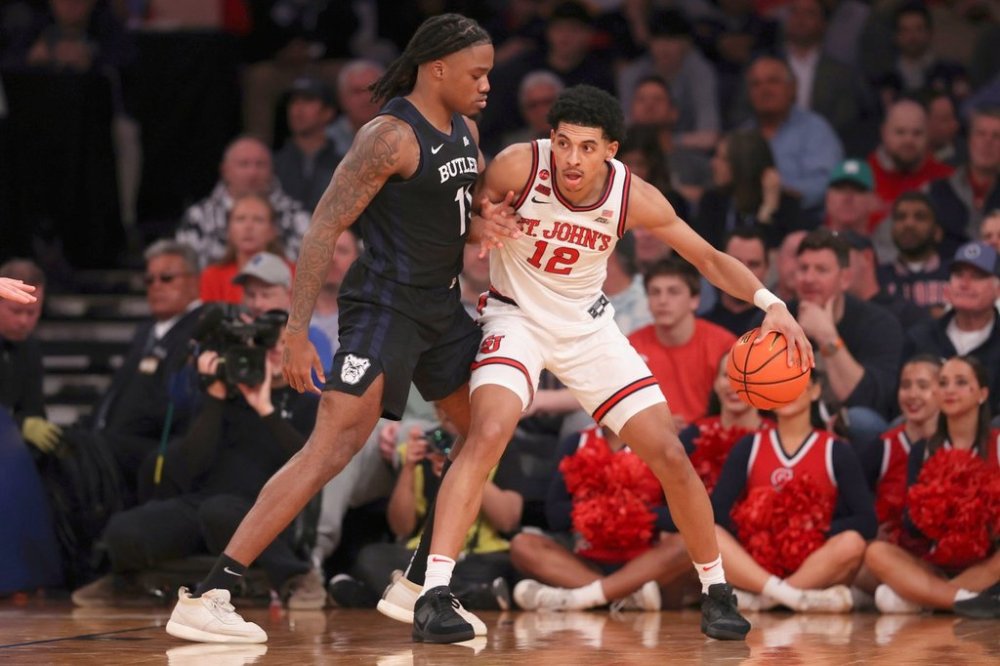 St. John's guard RJ Luis Jr. (12) works the ball against Butler forward Jahmyl Telfort, left, during the second half of an NCAA college basketball game in the quarterfinals of the Big East Conference tournament, Thursday, March 13, 2025, in New York. (AP Photo/Pamela Smith)