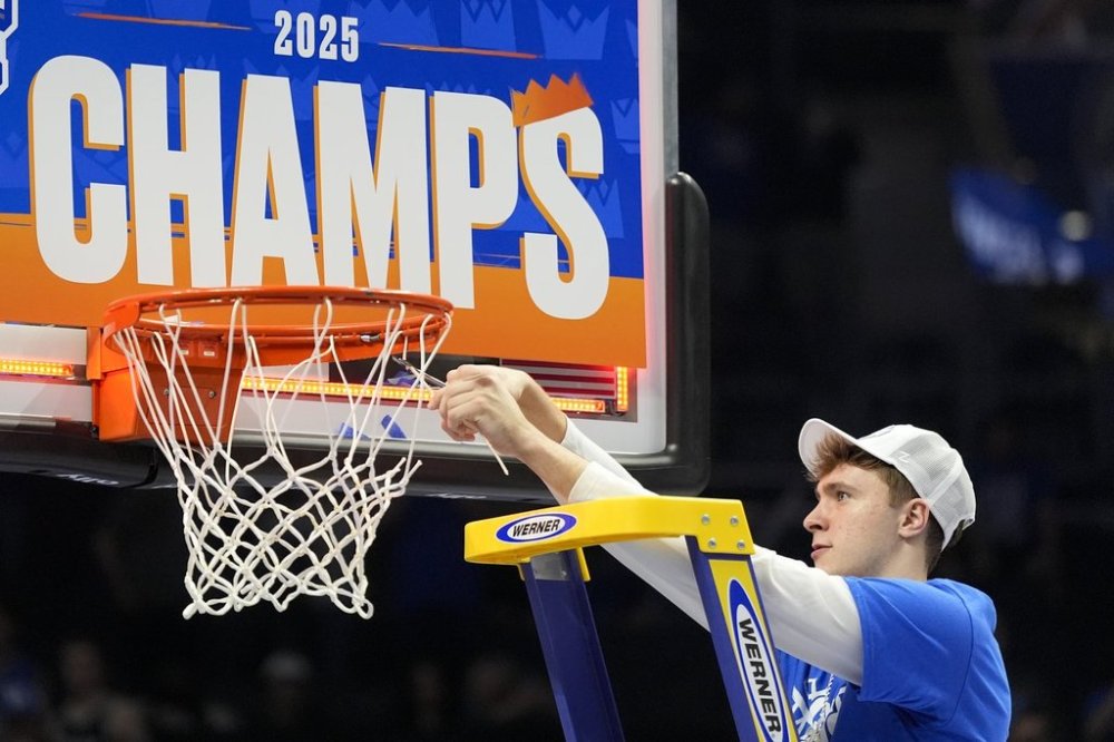 Duke forward Cooper Flagg cuts the net after their win against Louisville after an NCAA college basketball game in the championship of the Atlantic Coast Conference tournament, Saturday, March 15, 2025, in Charlotte, N.C. (AP Photo/Chris Carlson)