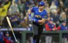 Seattle Mariners' Cal Raleigh tosses his bat after hitting a two-run home run during the eighth inning of a baseball game against the Texas Rangers, Friday, April 11, 2025, in Seattle. (AP Photo/Stephen Brashear)