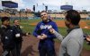 Los Angeles Dodgers' Freddie Freeman speaks to reporters during batting practice before a baseball game against the Atlanta Braves, Tuesday, April 1, 2025, in Los Angeles. (AP Photo/Kevork Djansezian)