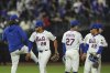 New York Mets' Juan Soto (22), Mark Vientos (27) and José Azocar (28) celebrate with teammates after a baseball game against the Arizona Diamondbacks Tuesday, April 29, 2025, in New York. (AP Photo/Frank Franklin II)